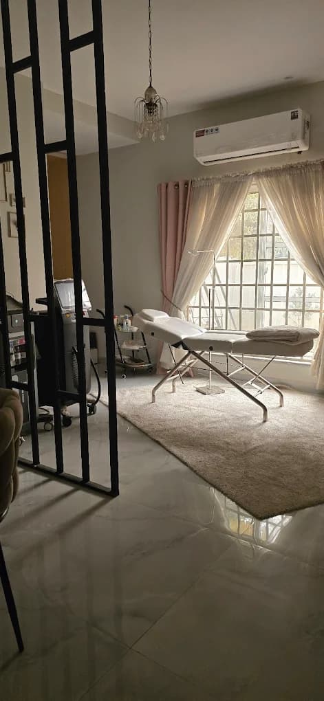 Private treatment area with laser equipment and a relaxing ambiance at Voila Lahore